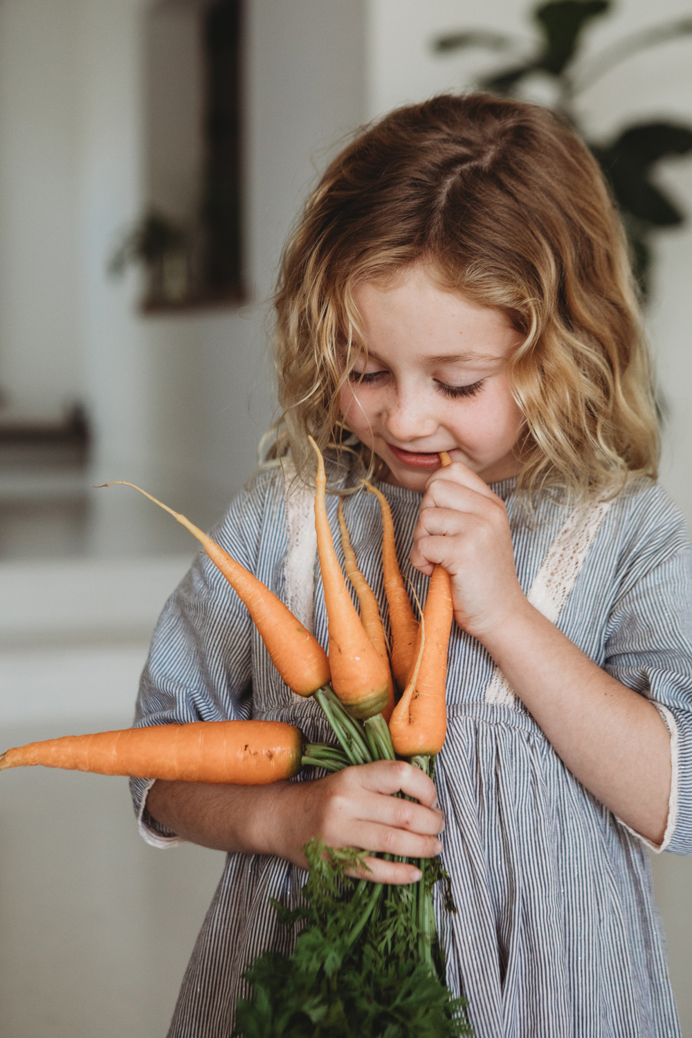Byron Bay daughter eating organic carrots