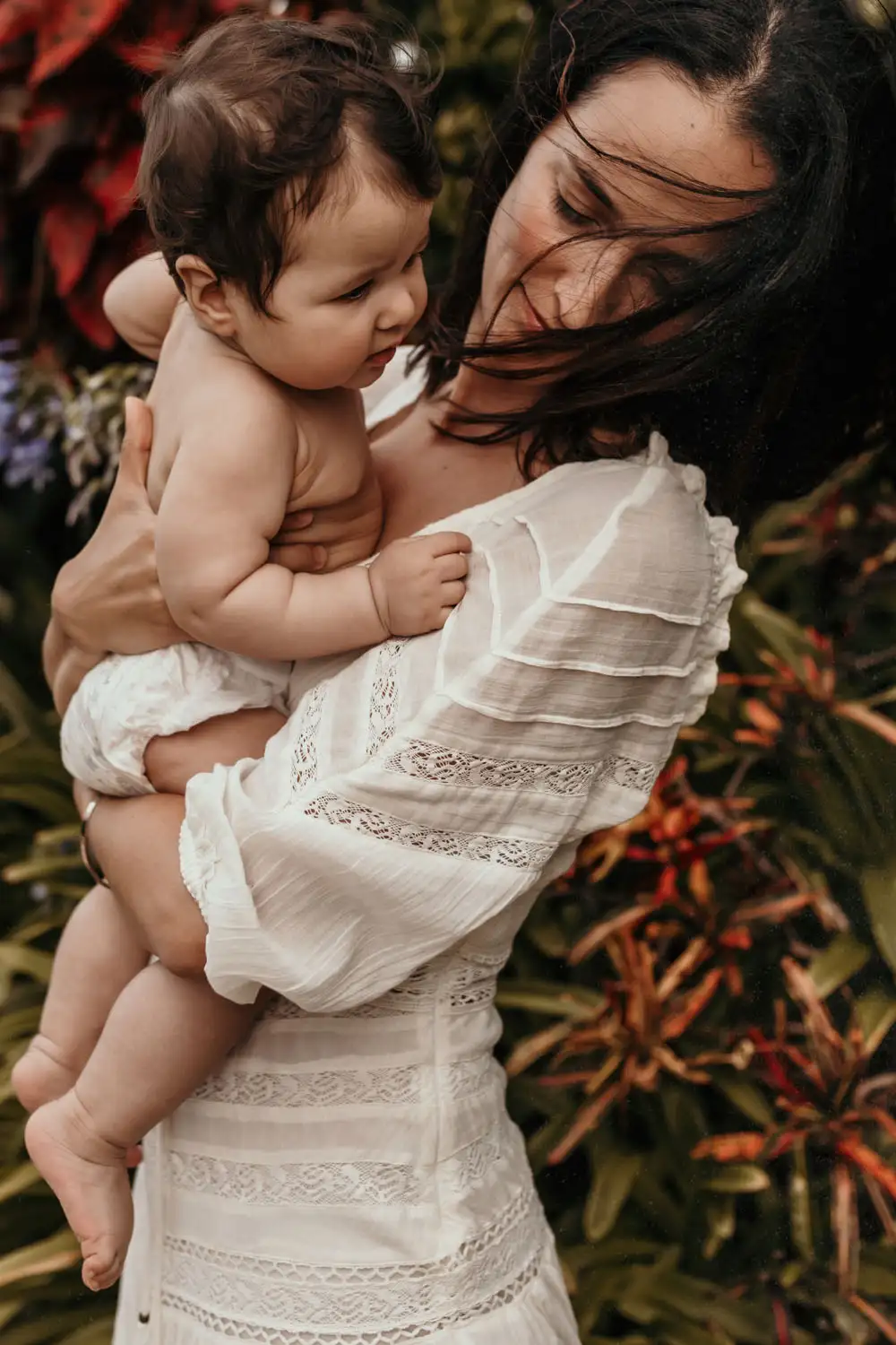 Mother and baby wind in hair